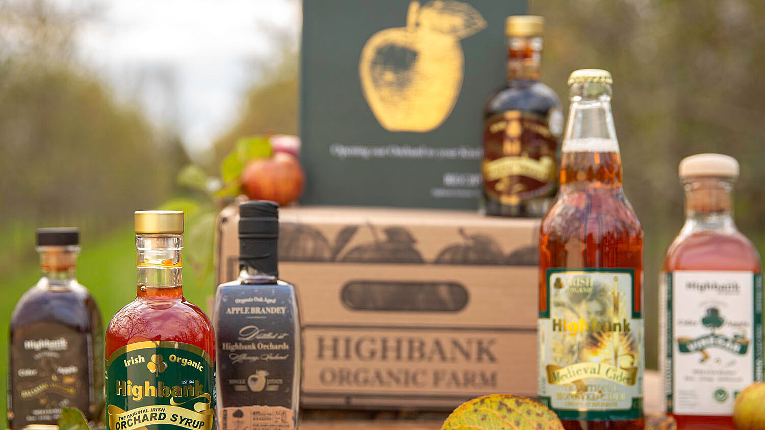 Selection of Highbank Apple Products available in a Hamper in the orchard