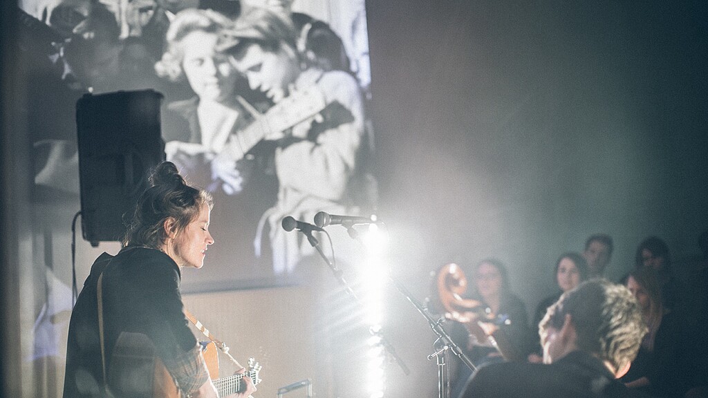 guitar player playing to audience