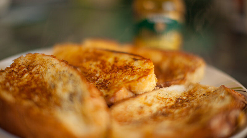4 pieces of french toast on a white plate